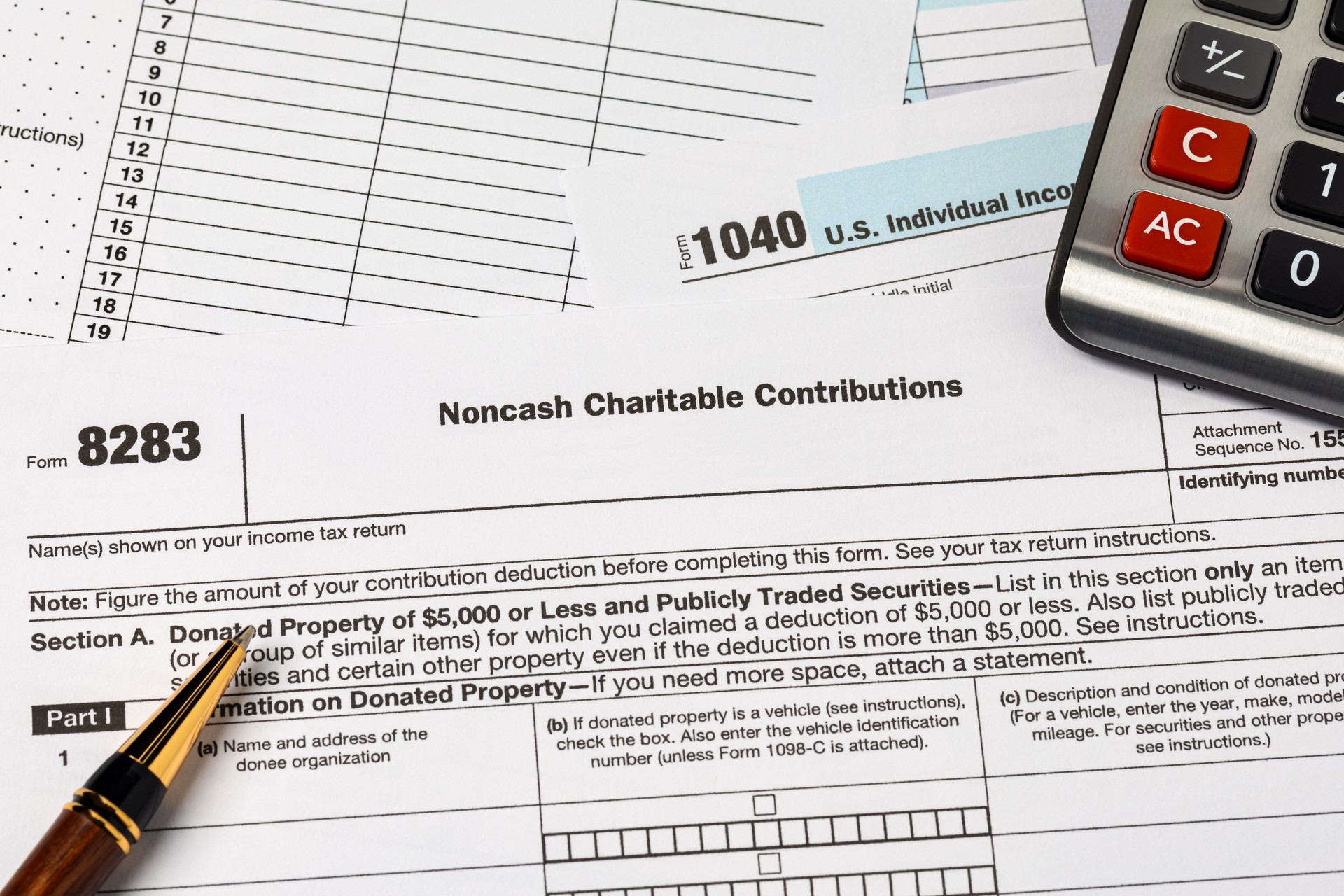 Noncash charitable contribution tax form. Charity donation, deduction and income tax return concept.